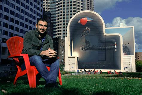 iranian artist mehdi ghadyanloo sits in front of his mural