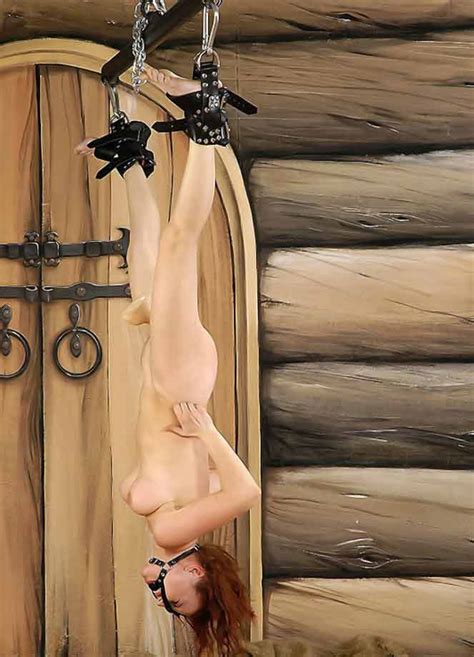 hanging upside down red haired girl torture photos