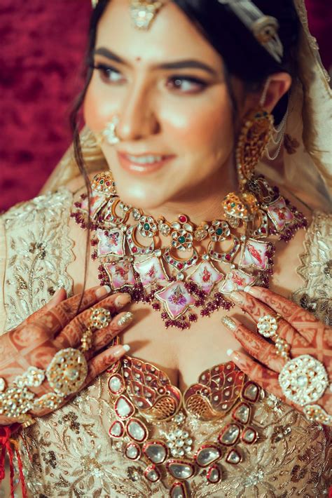 photo of bride wearing an enameled bridal choker with a rani haar
