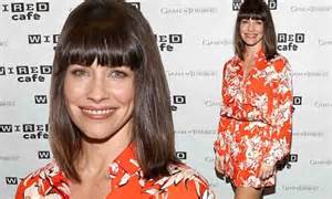 evangeline lilly shows off her slender legs in orange floral romper at comic con daily mail online