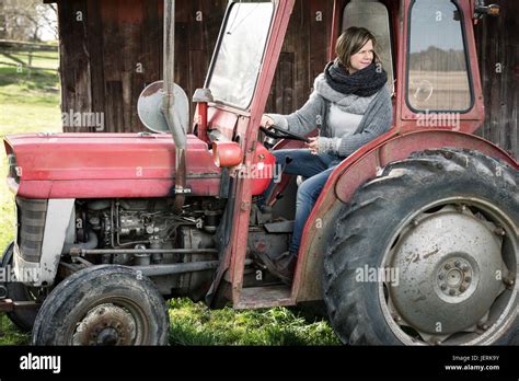 woman driving tractor stock photo alamy