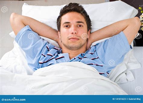 man relaxing  bed stock image image  pajamas home