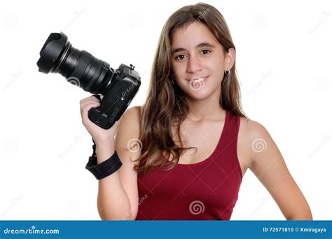 teenage girl holding professional camera   royalty