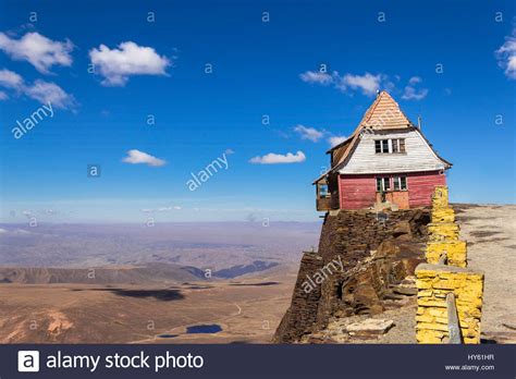 Old House Hanging On A Cliff Isolated Home On Top Of The