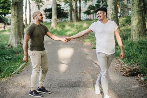 men holding hands  walking   stock photo