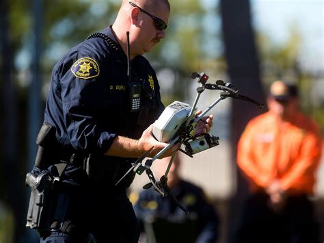 police departments  floating  idea   drones armed  stun guns business insider