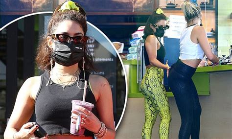 vanessa hudgens gives bff gg magree a playful booty slap after their