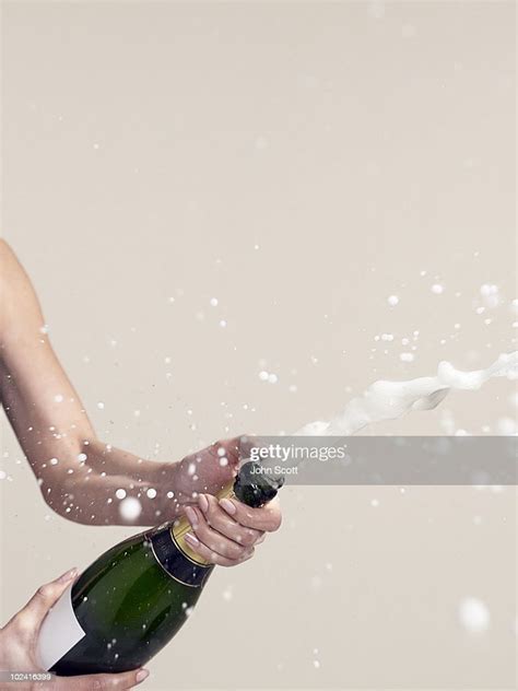 woman opening champagne bottle photo getty images