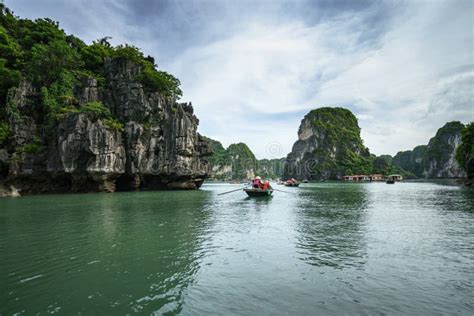 halong bay  vietnam unesco world heritage site  tourist rowing
