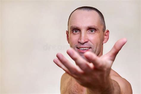 mature handsome man with a naked torso isolated on a white background