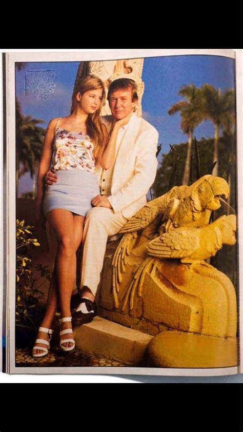 donald trump and his daughter ivanka sitting on a statue of two parrots