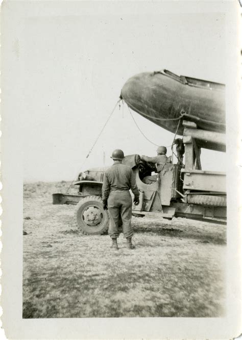 servicemen transporting a pontoon the digital