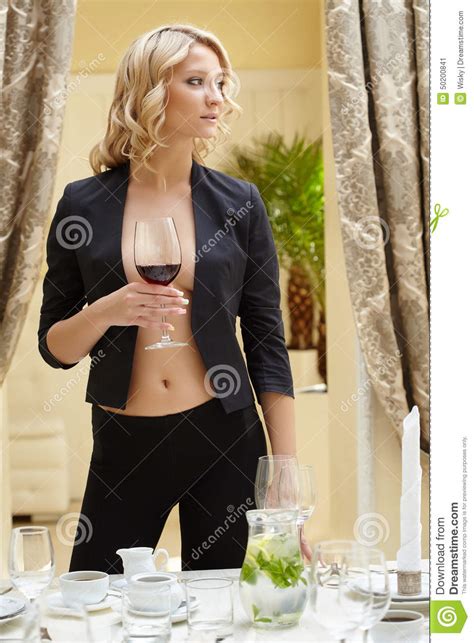 woman posing with glass of wine in restaurant stock image