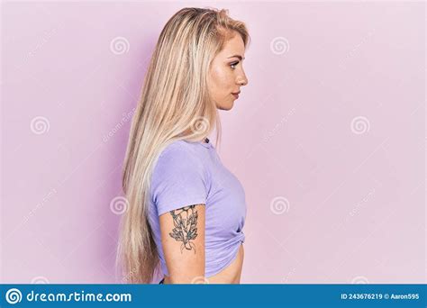 Young Beautiful Caucasian Woman Wearing Casual T Shirt Looking To Side