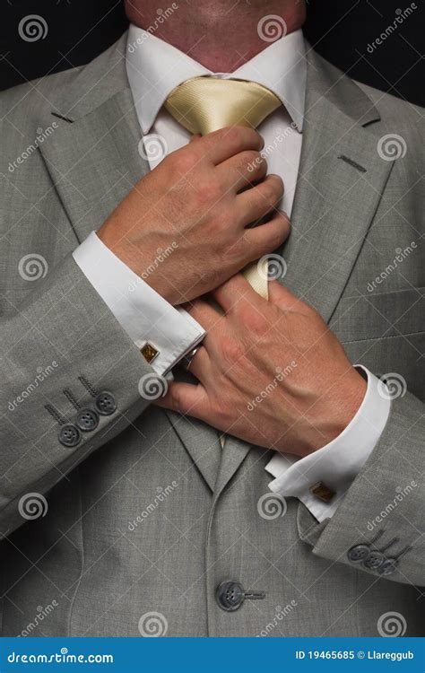 man adjusting tie stock image image  suit fashion