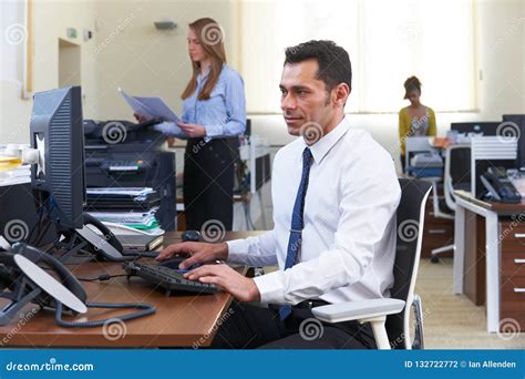 businessman working  desk  busy office stock photo image