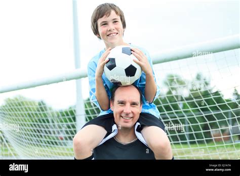 young soccer player father stock photo alamy