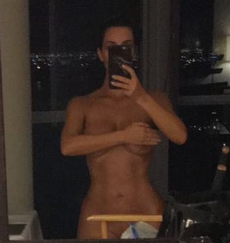 kim kardashian poses completely naked in naughty snapchat video but says she s just showing