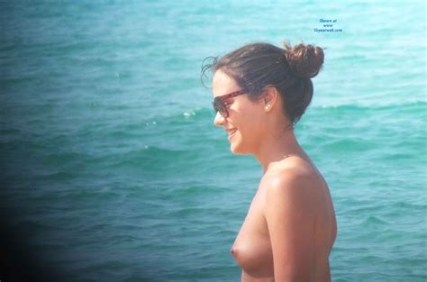 smiling and topless in beach february 2014 voyeur web hall of fame