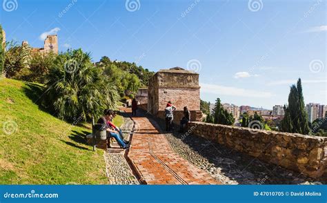 malaga spain november    alcazaba gardens   tourist enjoying  sun