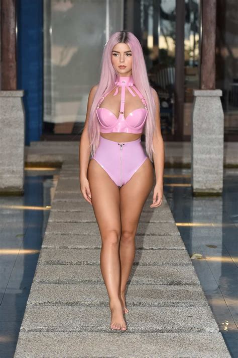 demi rose poses in a pink latex bikini during a photoshoot in phuket