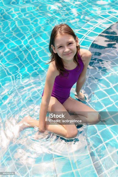 Cute Smiling Preteen Girl Sitting At Swimming Pool Edge Travel Vacation