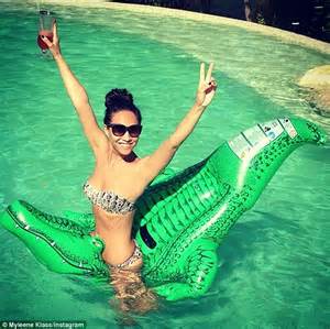 myleene klass poses on an inflatable while flashing her toned midriff daily mail online