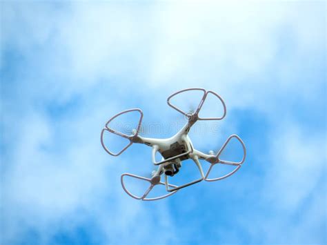 drone  flight isolated  blue sky  clouds stock image image  robot airplane
