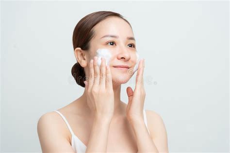 Face Skin Care Woman Applying Facial Cleanser On Face Closeup Girl