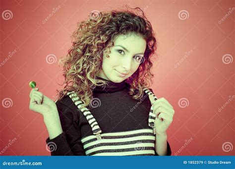 curly haired girl with a lollipop stock image image of striped