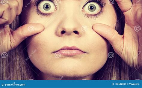 woman  weirdly wide open eyes stock photo image  insane