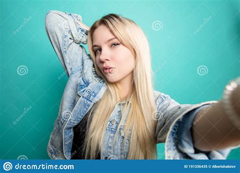 Positive Blond Haired Woman Taking Selfie On Isolated Blue Background