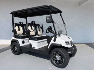 white evolution  ranger lithium golf cart  facing golf carts lifted