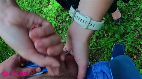 schoolgirl jerks off and sucks cock to classmate in a public park near