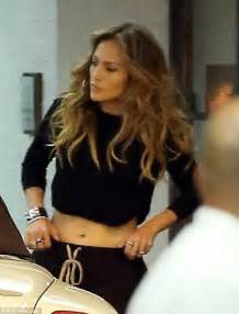 jennifer lopez shows taut tummy as she enjoys dinner with twins emme