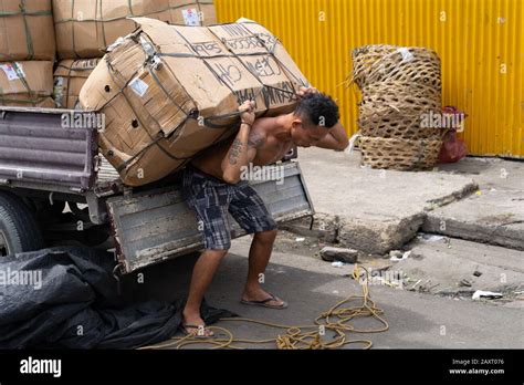 man carrying heavy load stock   man carrying heavy load