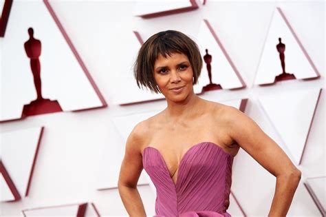 Halle Berry Shows Off Her Cleavage Wearing A Purple Gown At The 93rd