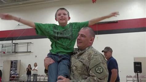military dad surprises son at school pep rally video abc