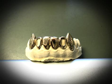gold teeth  bottom  extended fangs   grillzgodz