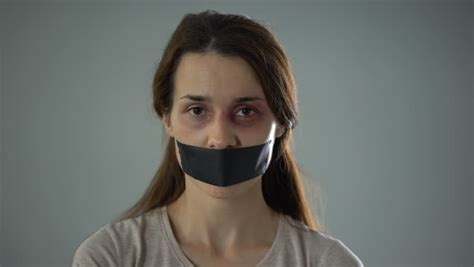 lady with taped mouth and stock footage video 100 royalty free 1016453173 shutterstock