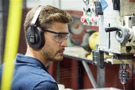 machinist working  factory stock photo dissolve