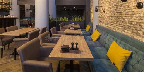 cute restaurant interior  sofas  wooden tables stock photo