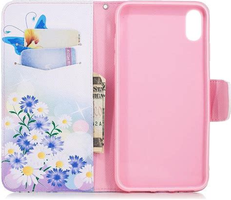 bolcom apple iphone xs max hoesje    bookcase met print vlinders en bloemen