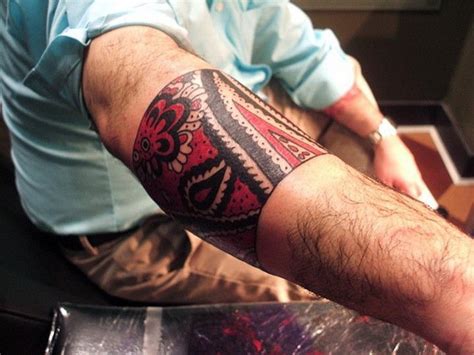 Great Red And Black Tribal Band Tattoo On Forearm Tattooimages