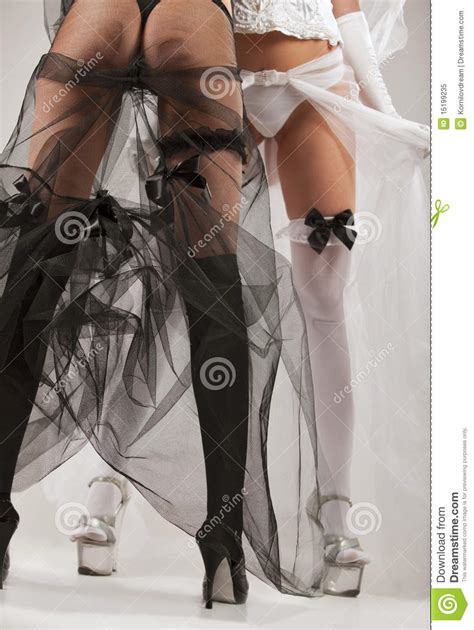 two women wearing black and white lingerie stock image image of body