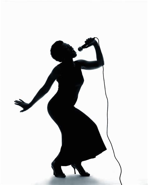 silhouette  female singer singing  microphone photograph  pm images