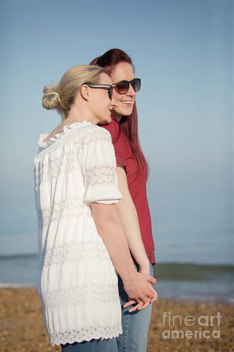 Lesbian Couple Holding Hands On Beach Photograph By Caia Image Science