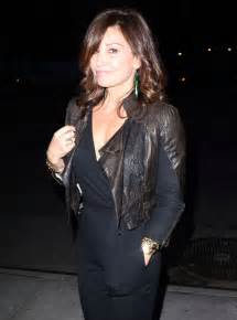 gina gershon leaving the turtle ball in new york city