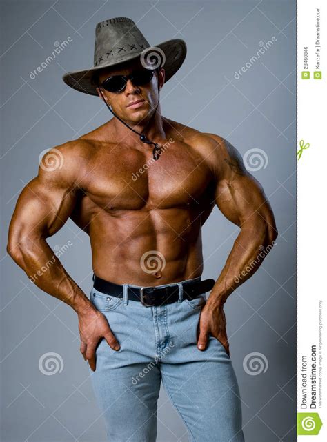 Handsome Muscular Man Wearing A Hat And Sunglasses Stock