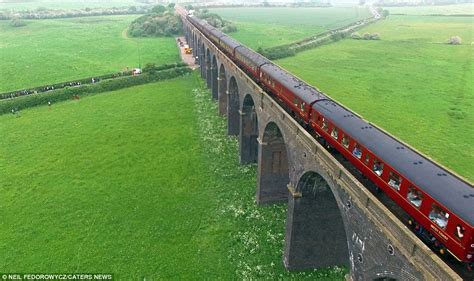 drone video footage shows  flying scotsman steaming   huge viaduct daily mail
